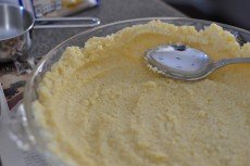 Press grits into plate to form crust